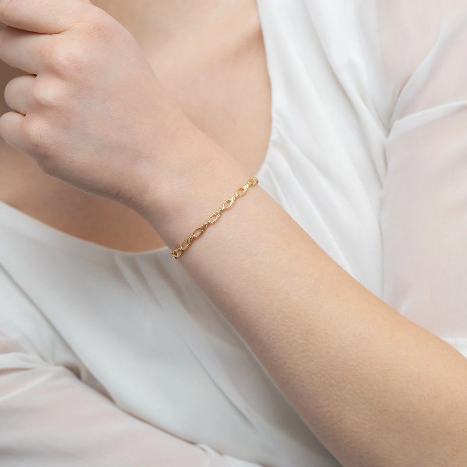 Goldarmband mit Tropfen und Perlen